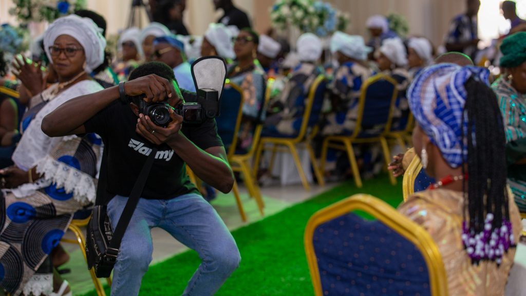 A Flammy crew member filming at an event